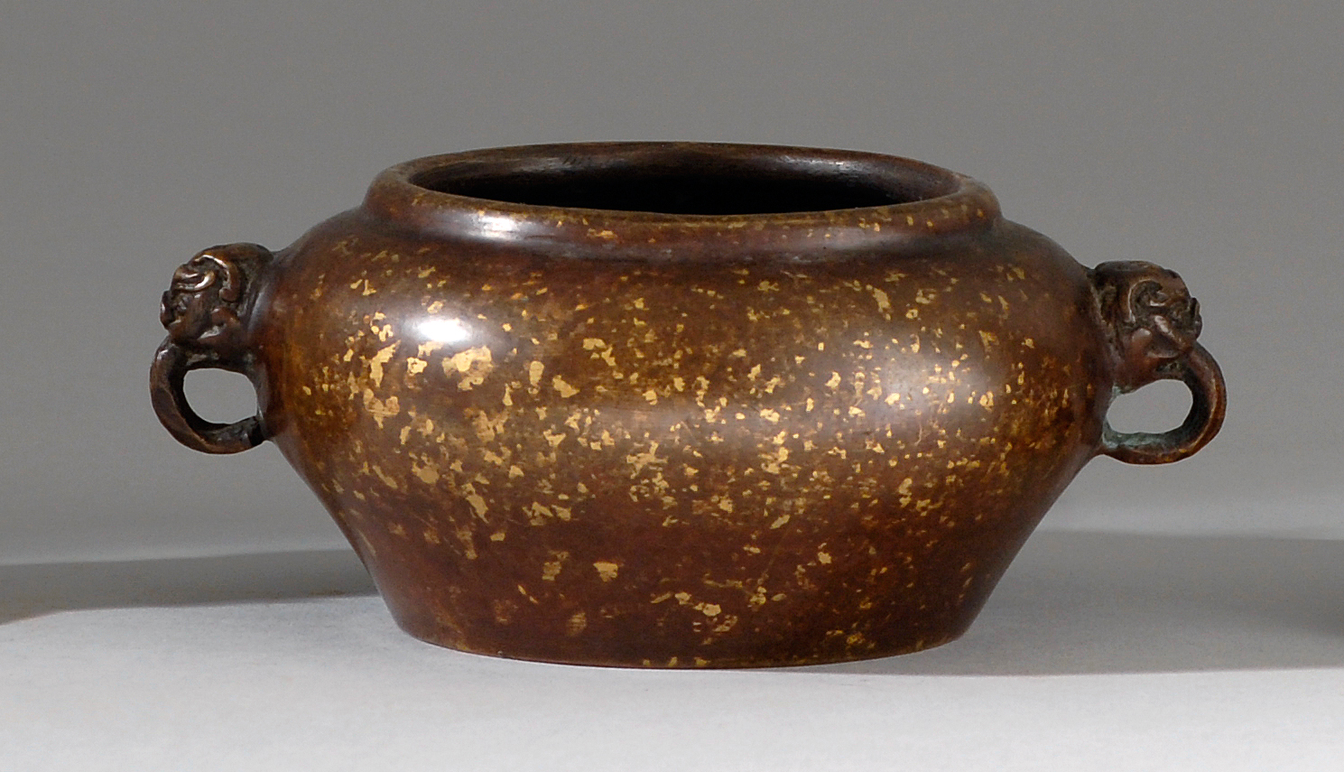 Appraisal: SUNSPOT BRONZE CENSER Early th CenturyIn squat ovoid form with