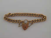 Appraisal: A carat gold curb link bracelet to heart padlock clasp