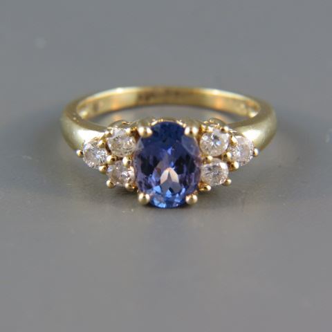 Appraisal: Tanzanite Diamond Ring oval gem weighing carats with diamonds on