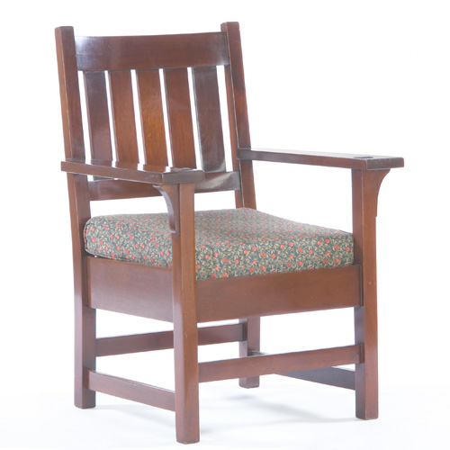 Appraisal: GUSTAV STICKLEY Mahogany armchair with five vertical backslats and a