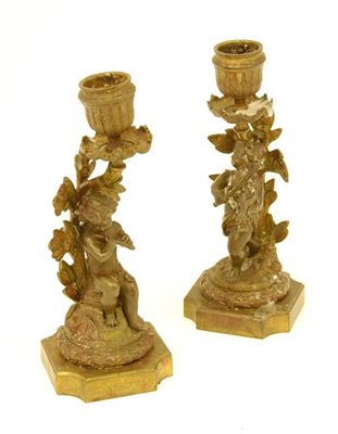 Appraisal: A pair of th century French bronze candlesticks modelled as