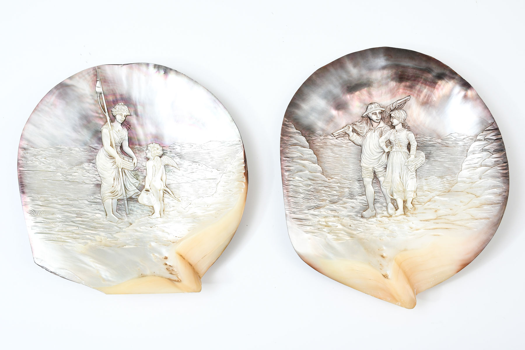 Appraisal: PAIR OF FINELY CARVED ABALONE SHELLS One having a female