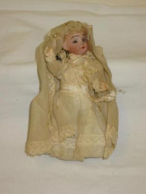 Appraisal: A bisque head dolls house doll with fixed pale grey