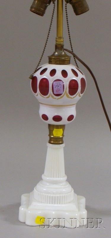 Appraisal: White Overlay Cut to Cranberry Glass Oil Lamp electrified