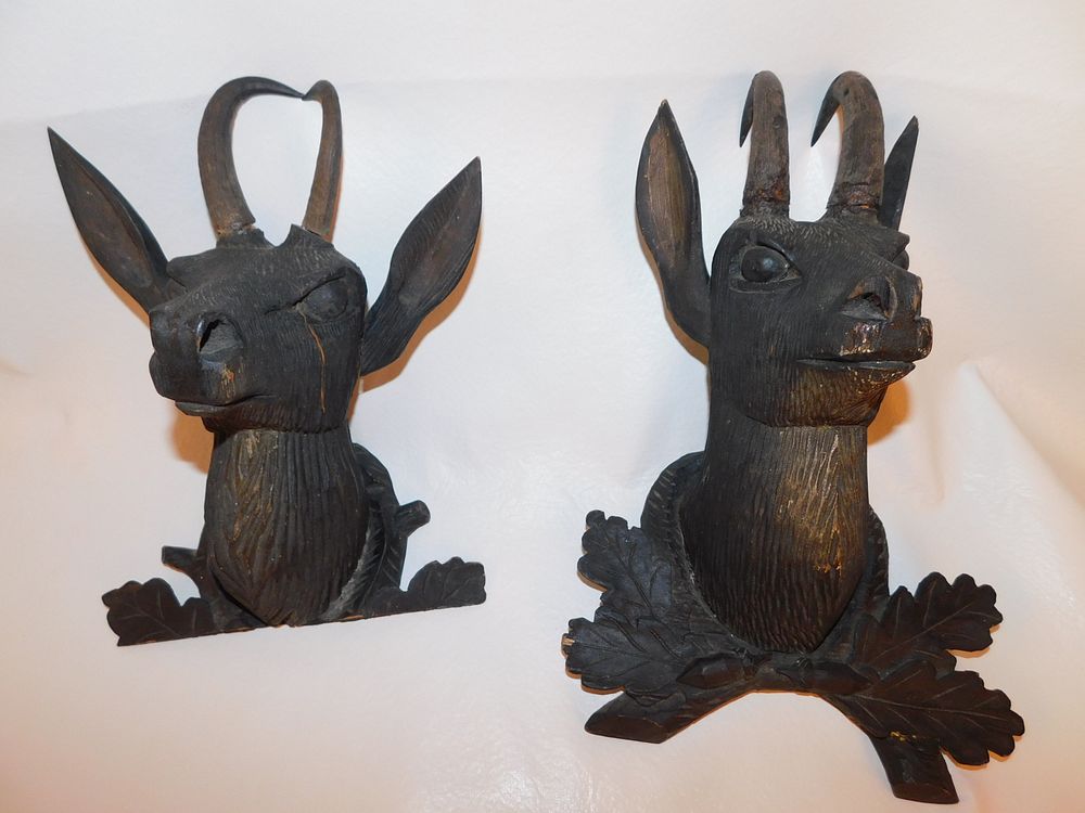 Appraisal: BLACK FOREST ANTELOPE PLAQUES Victorian carved wood Black Forest antelope