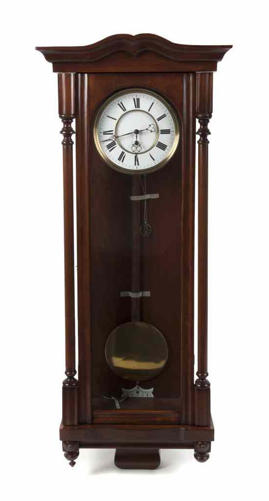 Appraisal: A Vienna Walnut Regulator Clock the circular dial with Roman