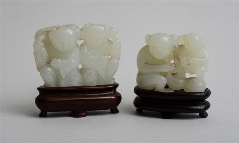 Appraisal: TWO CHINESE CARVED PALE GREEN JADE FIGURAL GROUPS The one