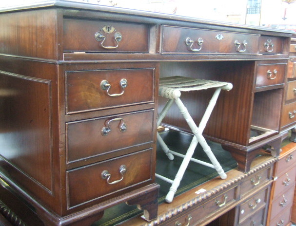 Appraisal: A th century mahogany pedestal desk with green leather gilt