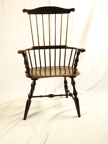 Appraisal: A Pennsylvania Windsor Comb-Back Armchair of mixed woods and old