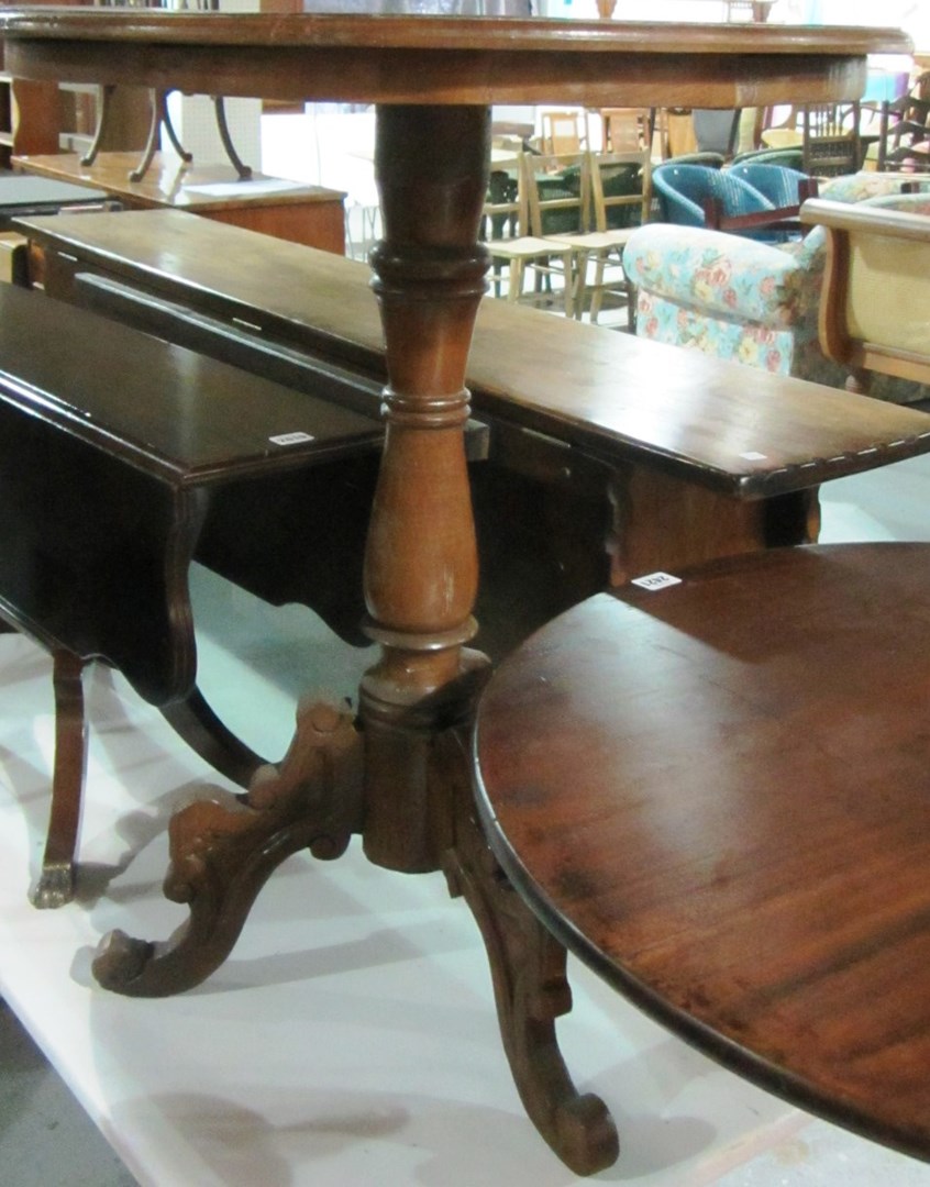 Appraisal: A mahogany circular tripod table and two wine tables