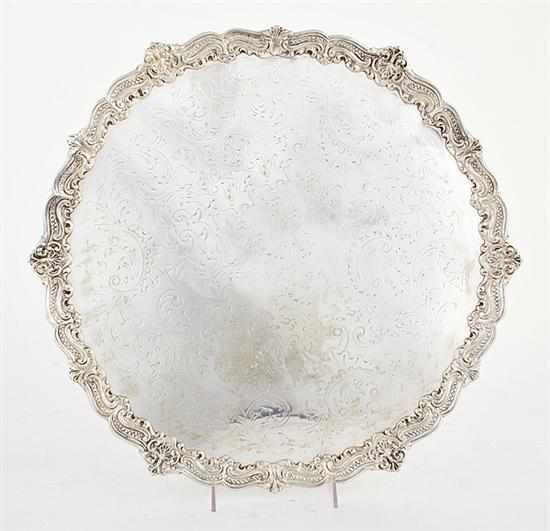 Appraisal: Large silverplate footed salver or serving tray round scalloped floral