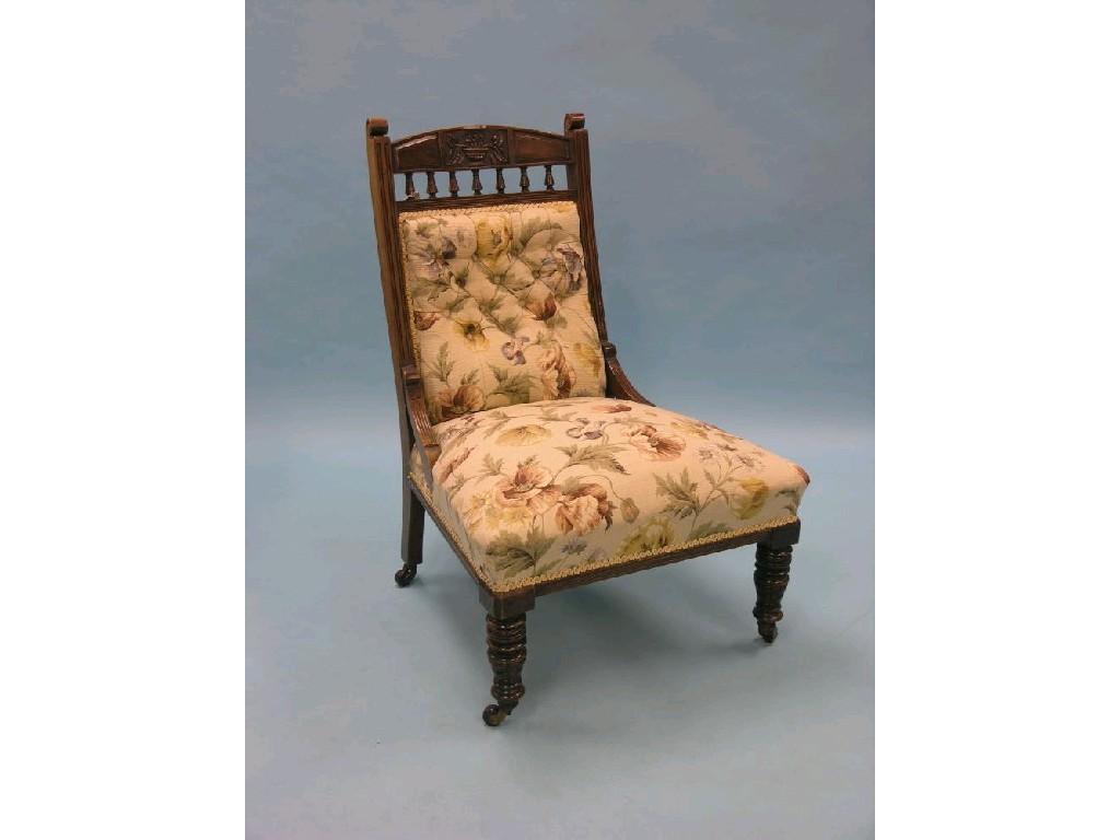 Appraisal: A Victorian walnut-framed drawing room chair spindle-back with carved detail