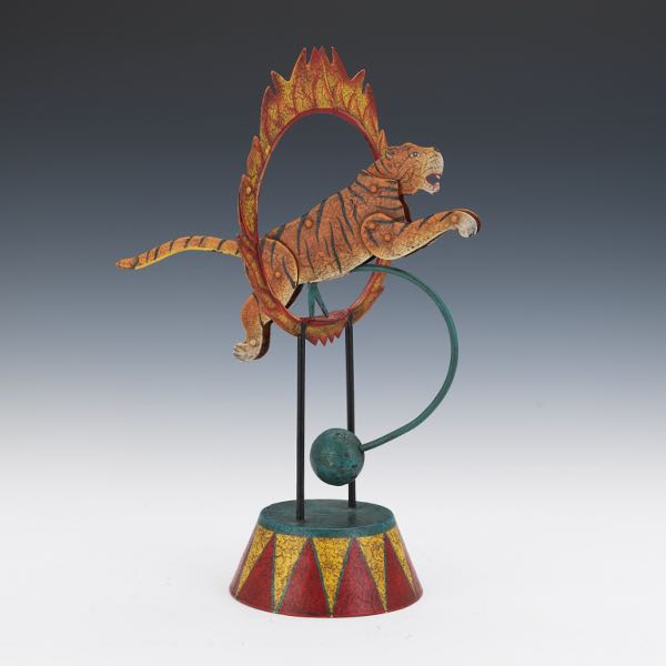 Appraisal: KINETIC JUMPING TIGER FIGURINE x x Polychromed metal kinetic sculpture