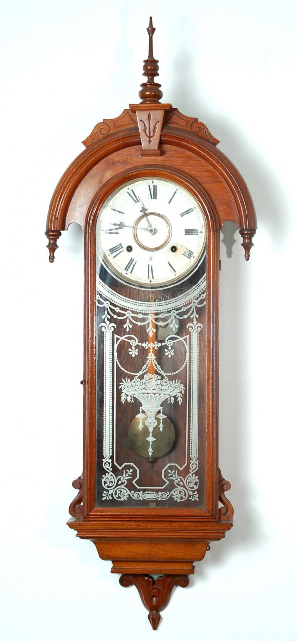 Appraisal: A Gilbert Eunomia wall clock Eight day time and strike