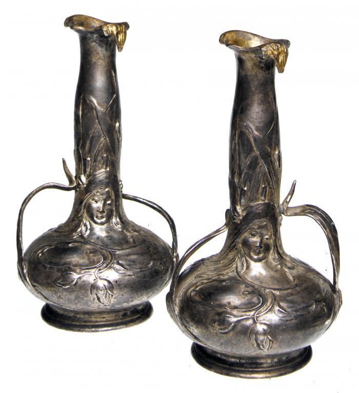 Appraisal: A PAIR OF JUGENDSTIL CAST AND SILVERED PEWTER VASES of