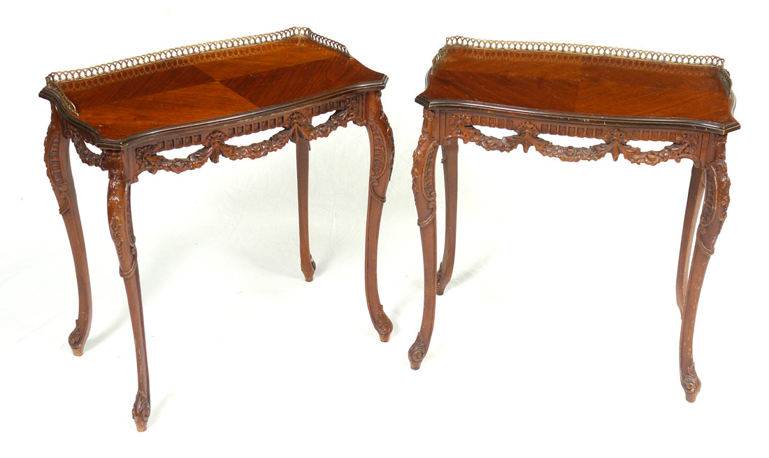 Appraisal: PAIR CARVED MAHOGANY FRENCH SIDE TABLES Pierced brass gallery shaped