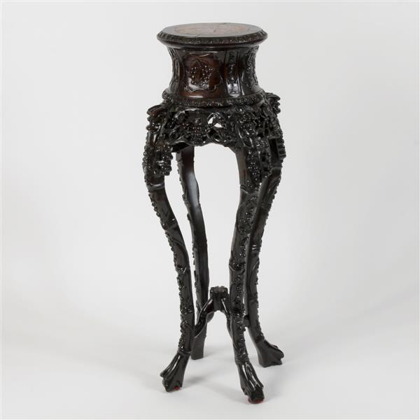 Appraisal: Chinese th century heavily carved black hardwood marble top plant