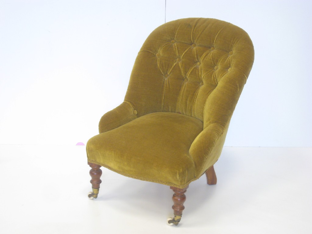 Appraisal: A Child's Victorian button upholstered Armchair on turned supports and