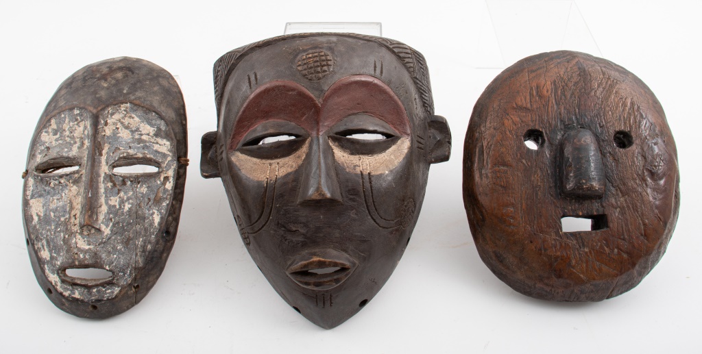 Appraisal: AFRICAN TRIBAL CARVED WOOD MASKS Three carved wood African tribal