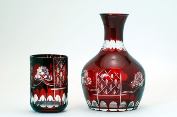 Appraisal: Bohemian ruby cut overlay decanter and tumbler alternating panels of