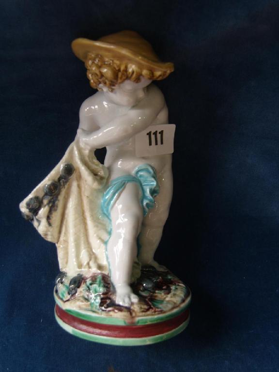 Appraisal: A th century Royal Worcester majolica figure of a young