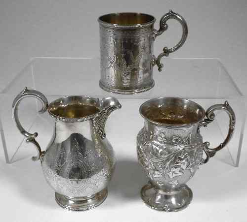 Appraisal: A Victorian silver christening mug the chased bulbous body embossed