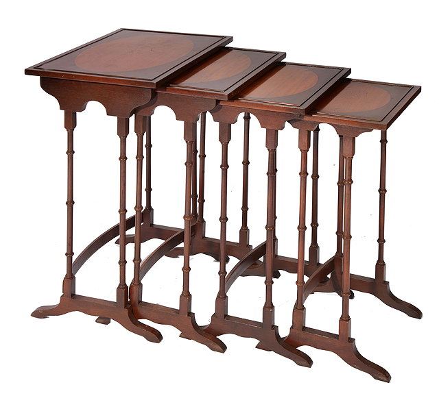 Appraisal: A NEST OF FOUR MAHOGANY OCCASIONAL TABLES with decorative inlay