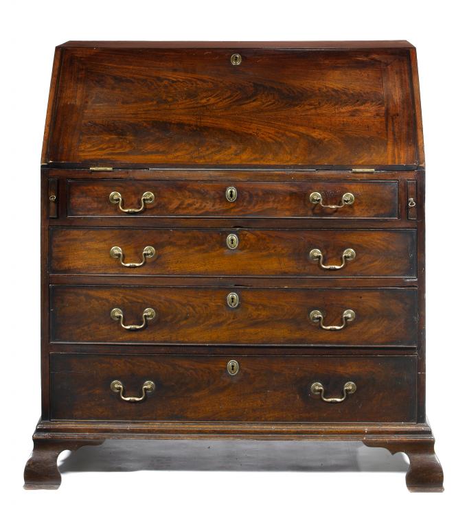 Appraisal: A GEORGE III MAHOGANY BUREAU the curl veneered flap enclosing