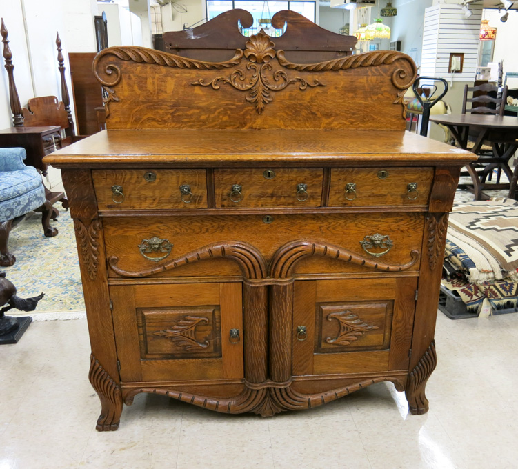 Appraisal: LATE VICTORIAN CARVED OAK BUFFET American late th century having