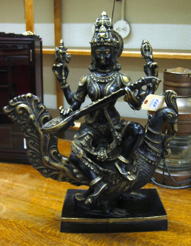 Appraisal: AN EAST INDIAN BRONZE SCULPTURE Buddha enthroned on a rooster