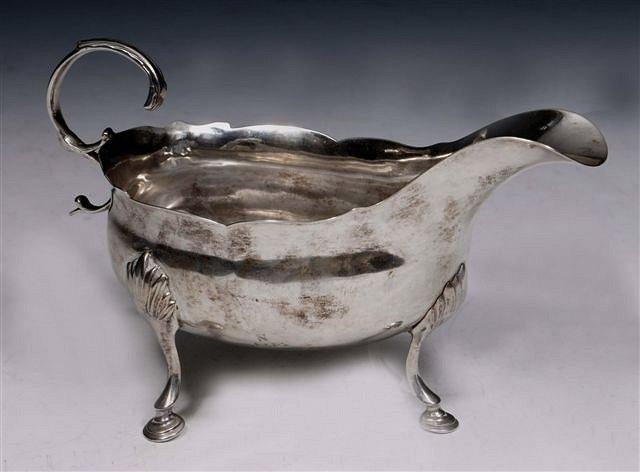 Appraisal: A GEORGE III SILVER SAUCE BOAT with wavy edge cabriole