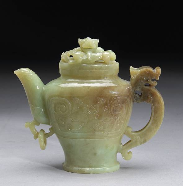 Appraisal: A mottled jade covered ewer th Century Of flattened hu