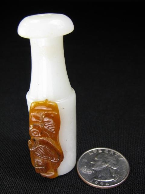 Appraisal: White pipe stem with deep amber glass decoration depicting what