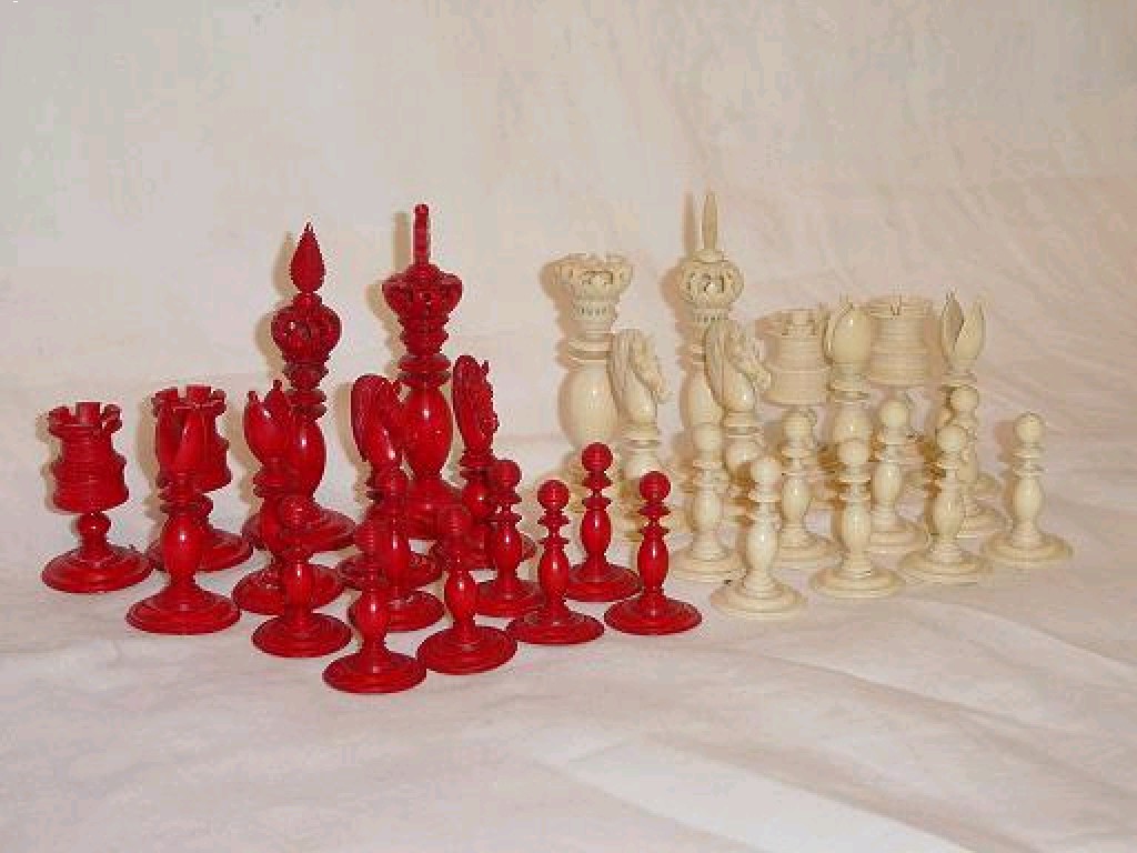 Appraisal: A set of turned and coloured ivory chessmen