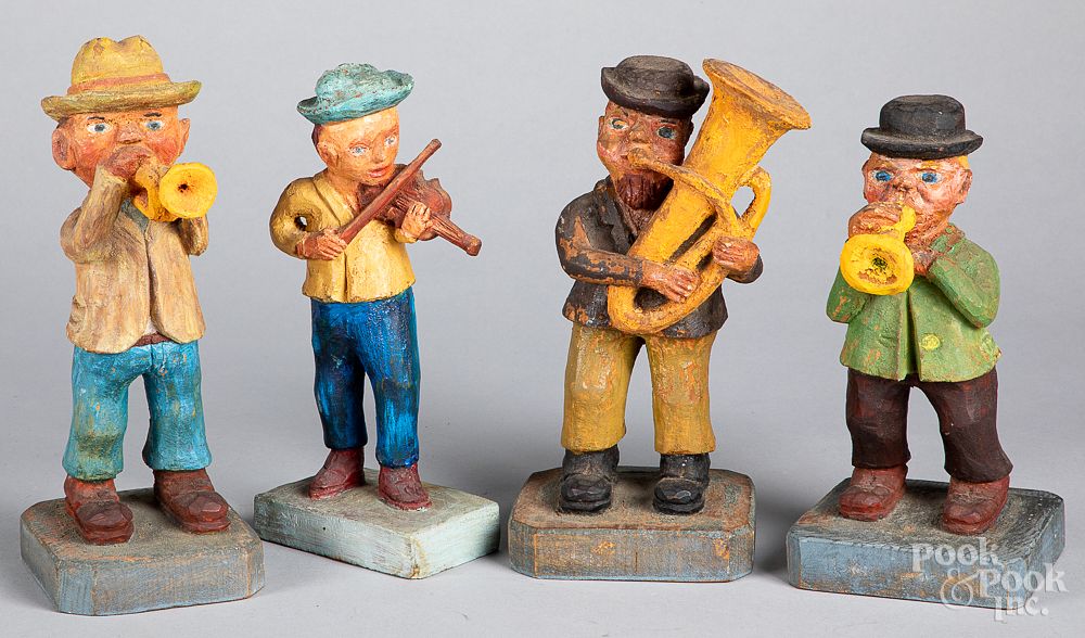 Appraisal: Four carved and painted musicians th c Four carved and