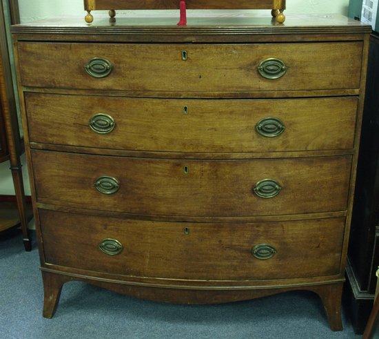 Appraisal: An early th Century mahogany bow front chest of four