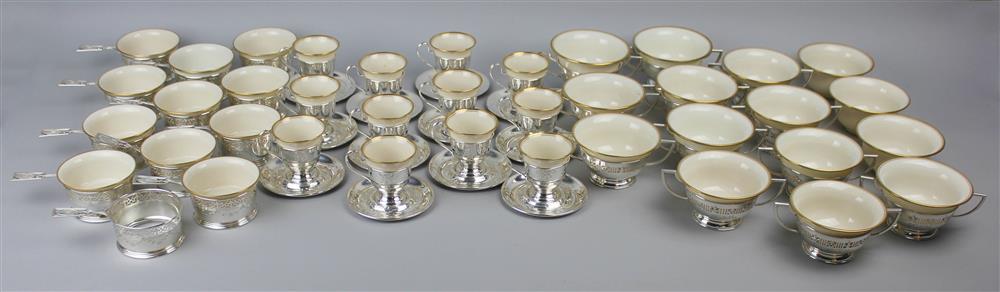 Appraisal: THREE SETS OF AMERICAN SILVER CUP HOUSINGS WITH LENOX PORCELAIN