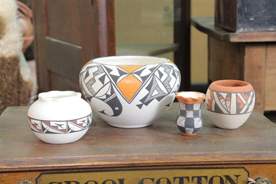 Appraisal: FOUR CONTEMPORARY AMERICAN INDIAN POTTERY JARS Polychrome slip designs three