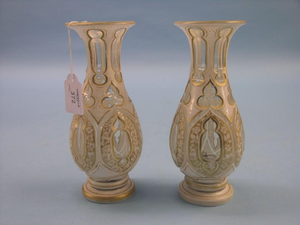 Appraisal: A pair of th century Bohemian overlaid glass vases bulbous-shape