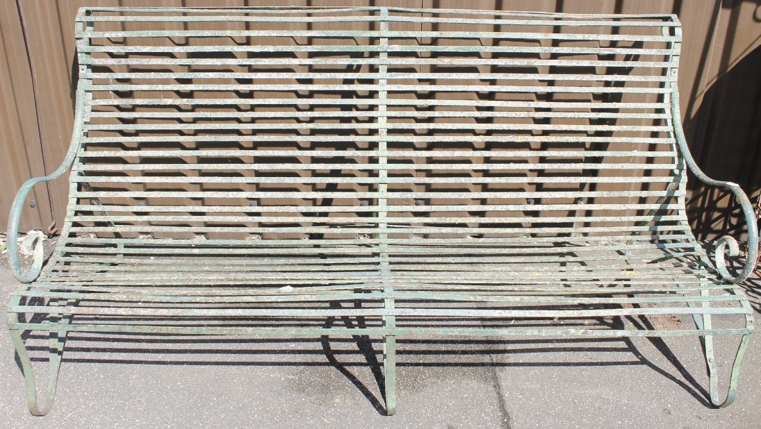 Appraisal: An early thC wrought iron garden bench of slatted outline