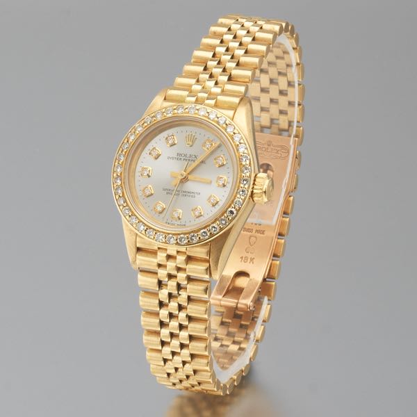 Appraisal: LADIES' ROLEX OYSTER PERPETUAL K GOLD AND DIAMOND AUTOMATIC WATCH