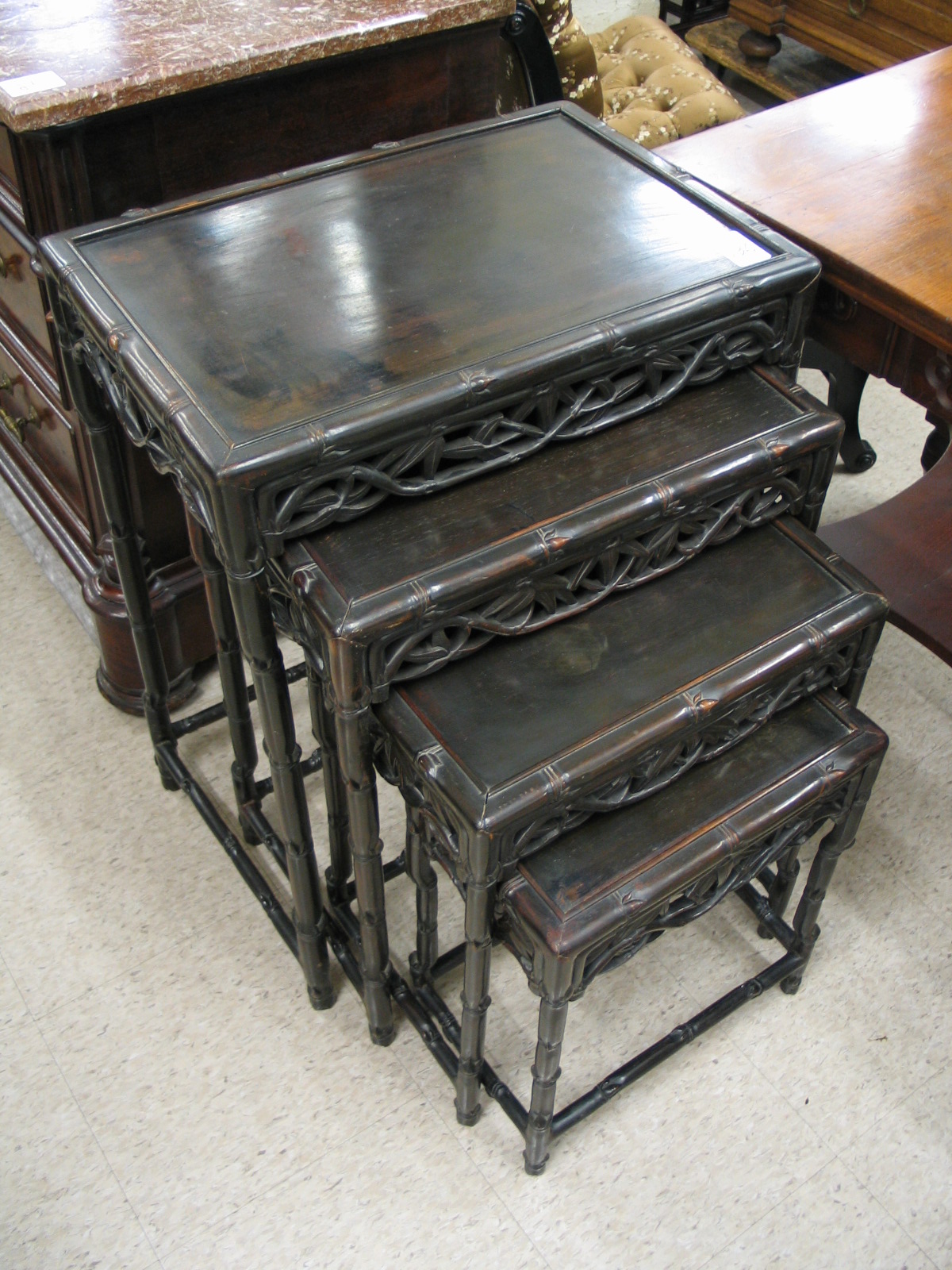 Appraisal: SET OF CARVED HONGMU QUARTETTO TABLES Chinese early th century