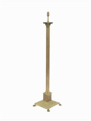 Appraisal: A brass standard lamp with ribbed column and corinthian capital