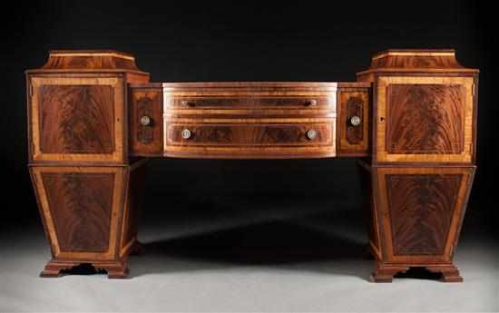 Appraisal: Edwardian Sheraton style cabinet-made banded mahogany double pedestal sideboard late