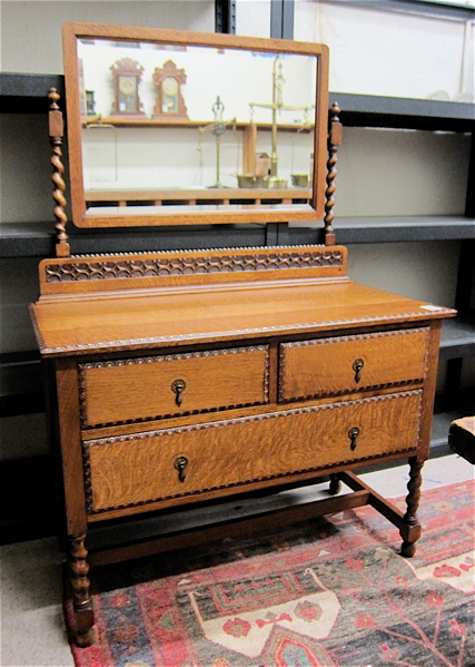 Appraisal: AN OAK DRESSER WITH ATTACHED TILT MIRROR English early th