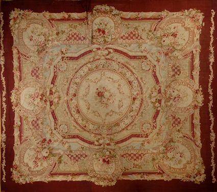 Appraisal: AUBUSSON-STYLE NEEDLEWORK CARPET The tan field with central rondel within