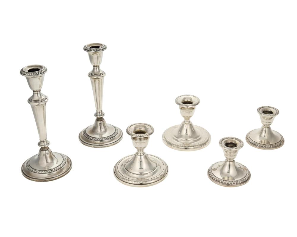 Appraisal: A group of weighted sterling silver candlesticks th Century Each