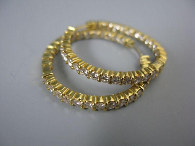 Appraisal: KT Yellow Gold Diamond Hoop Earrings containing diamonds with an