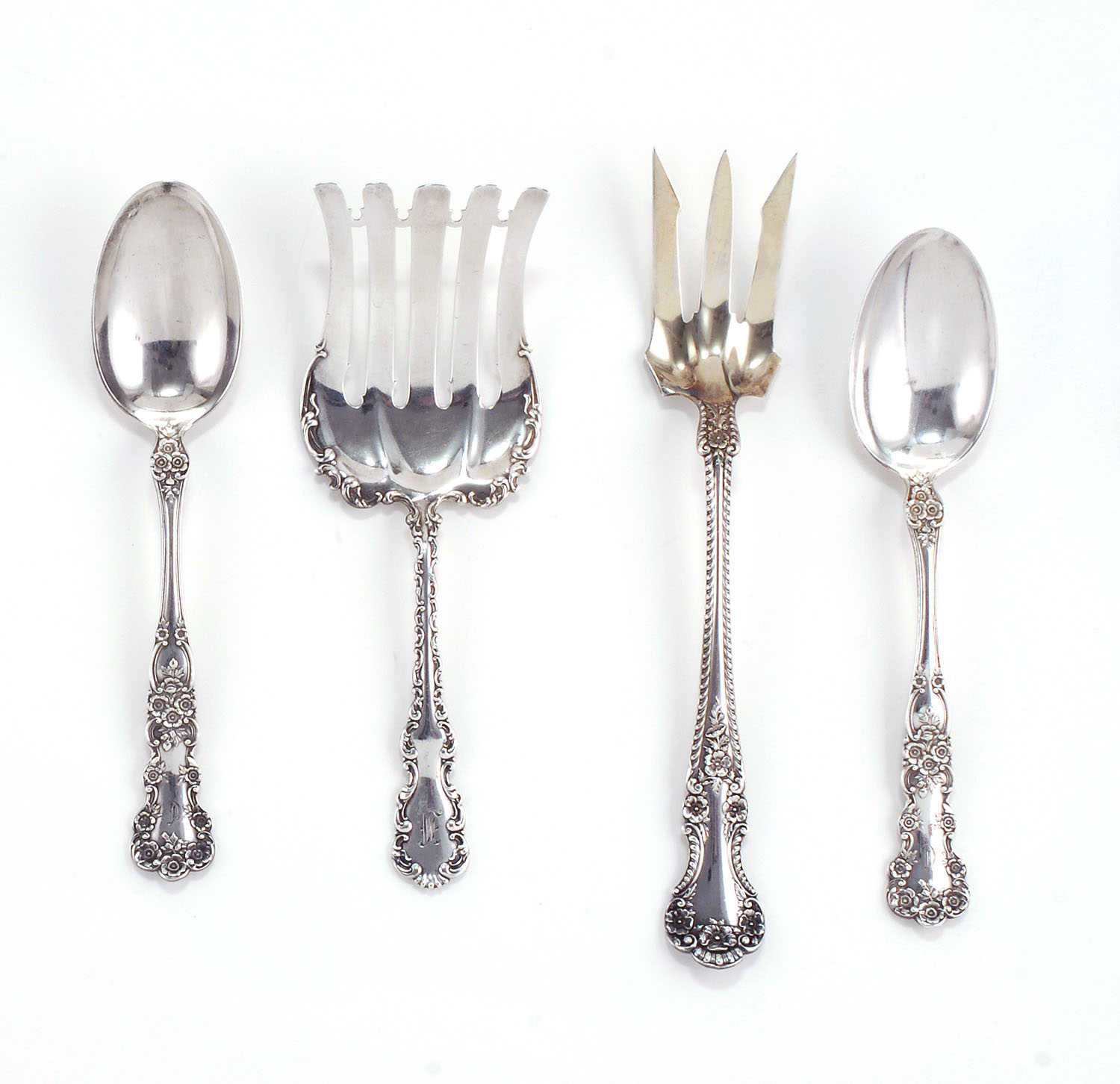 Appraisal: FOUR STERLING SILVER SERVING PIECES A serving fork by Whiting