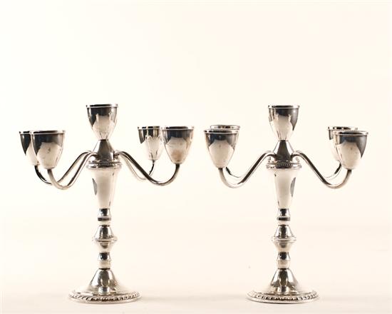 Appraisal: A Pair of Sterling Metamorphic Candelabra by Duchin five branch